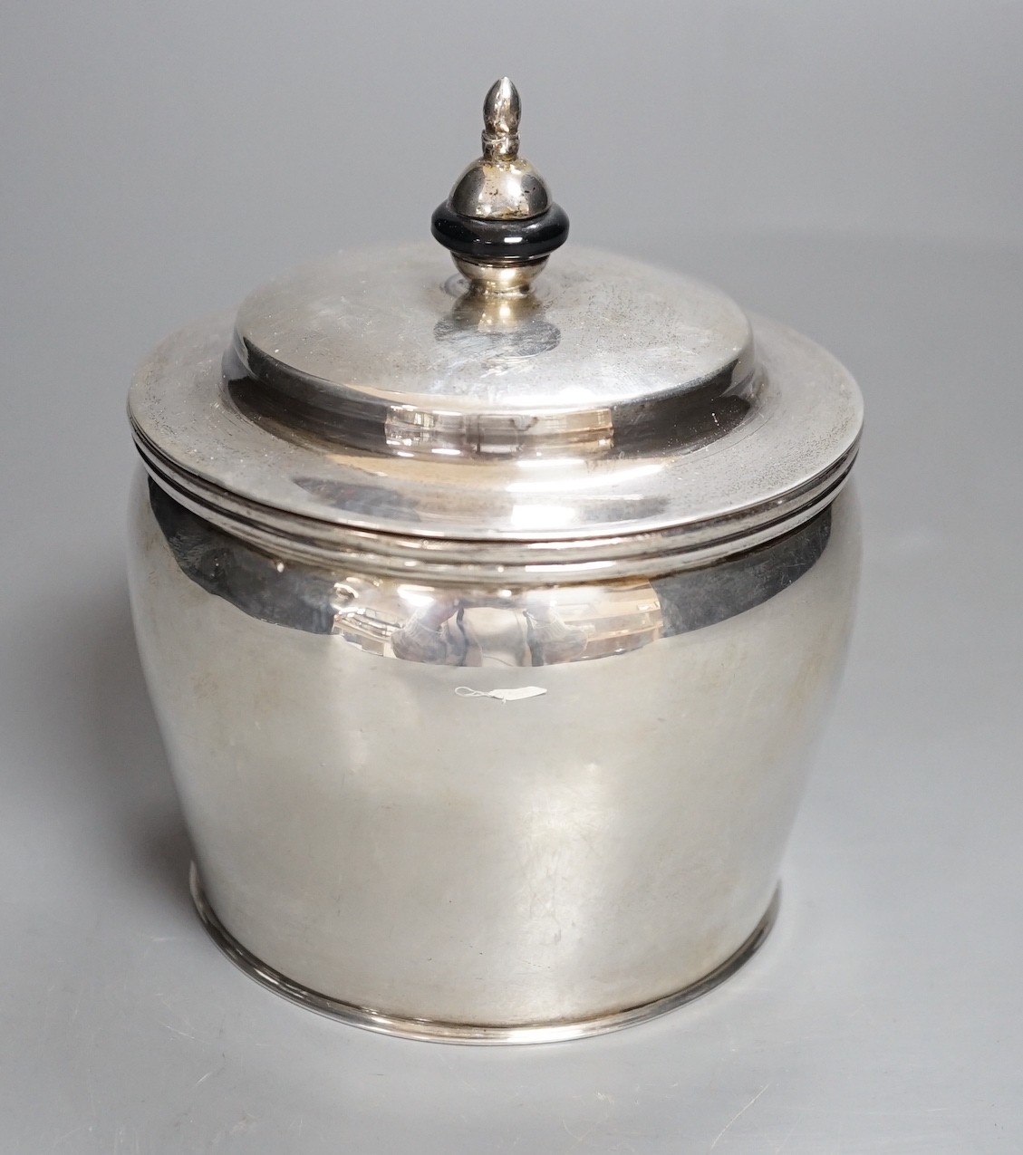 A 20th century continental white metal circular pot and cover, with pseudo marks, height 13cm, gross weight 12 oz.